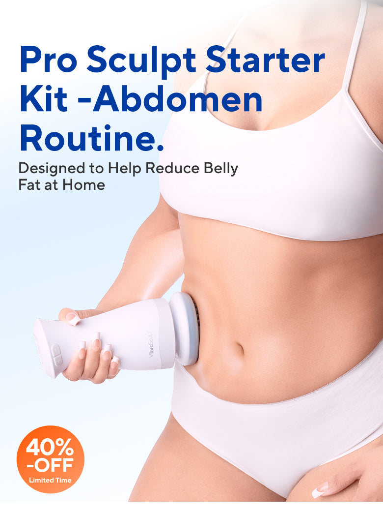 Woman using the Vibro Sculpt device on her abdomen to support abdominal fat reduction as part of an at-home body contouring routine.