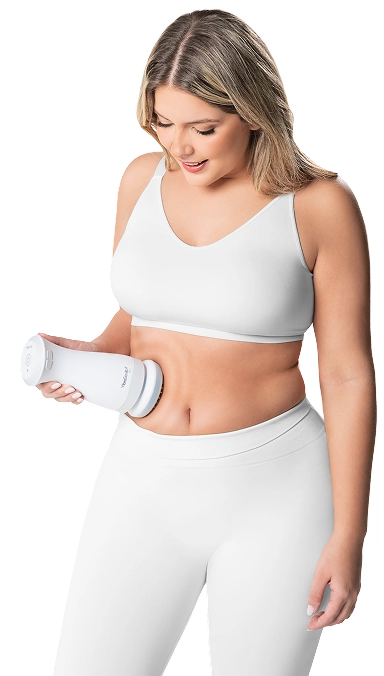 Woman following a simple at-home routine with Vibro Sculpt on her abdomen to help reduce abdominal fat and improve waist contour.